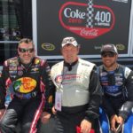 Tom Cavalli sitting with Bubba Wallace and Tony Stewart.