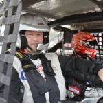 Tom Cavalli and NASCAR driver Greg Biffle strapped into race ca.