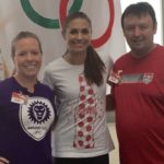 Tom and Leigh Cavalli posing for picture with Alex Morgan.