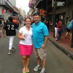 Tom and Leigh Cavalli standing on Bourbon Street smiling for a picture