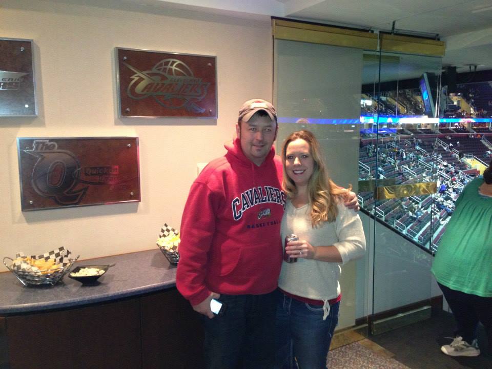 Tom and Leigh Cavalli standing in an NBA Suite.