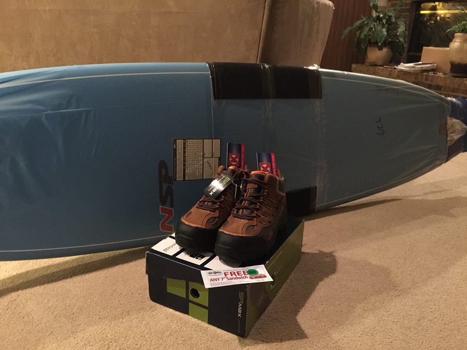 Picture of a surfboard, shoes and coupon for free lunch.