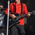Bon Jovi performing with guitar