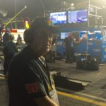 Man standing in the pit lane of the Darlington NASCAR track