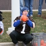 Tom Cavalli holding a football at Browns Stadium
