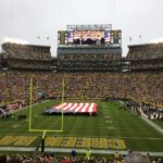 American flag stretched across the Green Bay game for the National Anthem