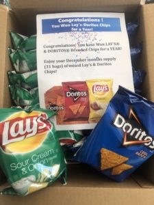 First box of a years worth of Lay's and Doritos branded chips for a year