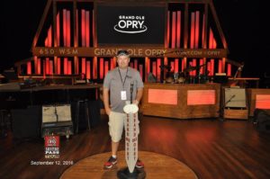 Tom Cavalli standing on the stage of the Gran Ole Opry