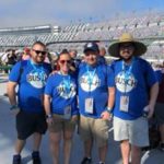 Tom and Leigh Cavalli with friends on the track at the Daytona 500